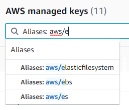 Search box for AWS managed keys with Aliases filter and example entries.